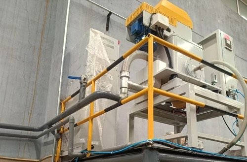 Coolant filtration system installed for removing metal fines from industrial process fluid