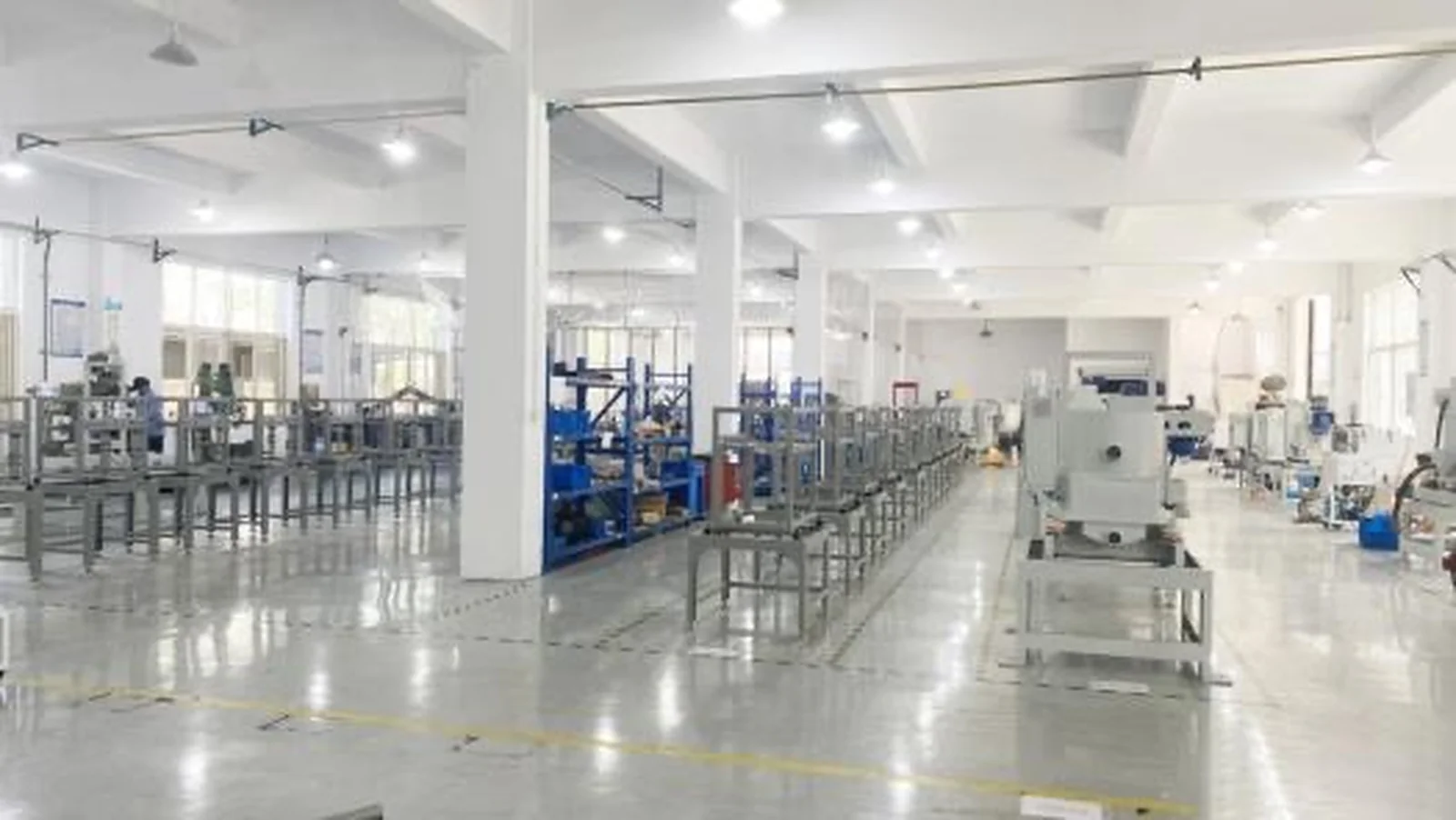 Industrial equipment and assembly frames inside a production workshop